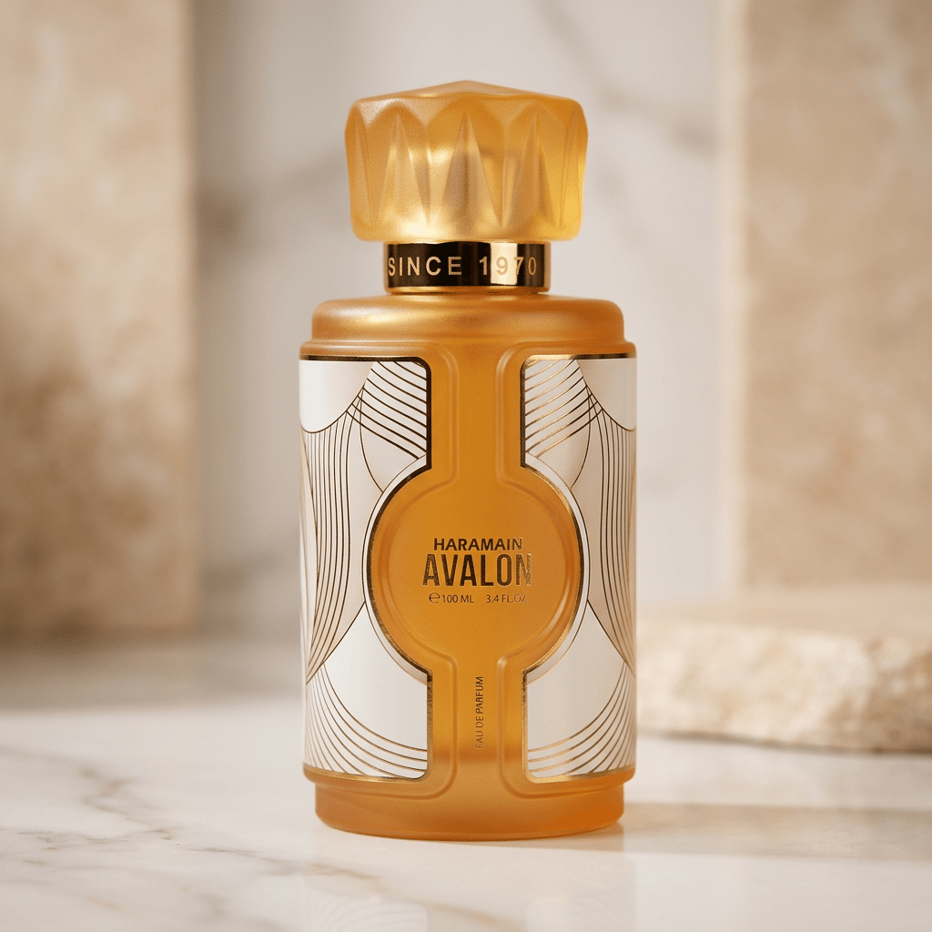 Perfume Avalon da Al Haramain em frasco laranja e branco com padrão geométrico, sobre superfície de mármore claro.