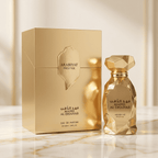 Perfume Mahd Al Dhahab da Arabiyat Prestige em frasco dourado facetado, ao lado da caixa dourada.