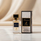 Perfume Florenza da Maison Alhambra em frasco com rótulo azul-marinho e dourado, ao lado da caixa com estampa floral rosa