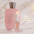 Frasco rosa do perfume Hawas Éclat for Her ao lado de um decant de 5 ml, anúncio de disponibilidade em decant.