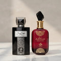 Perfumes Attar Al Wesal em frasco preto e Sabah Al Ward em frasco vermelho, ambos com tampas facetadas pretas, lado a lado sobre mármore